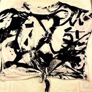 Selling a cropped shirt tied from soho jeans and has a black and white design